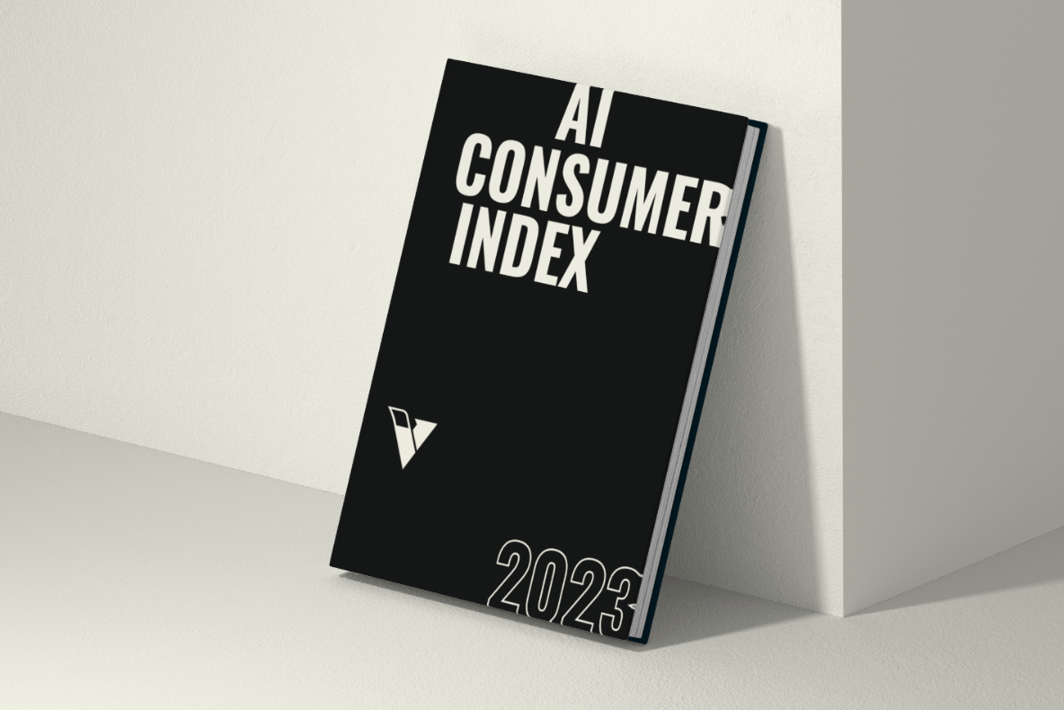 A black book leaning against a cream coloured wall, written on the front cover is AI Consumer Index 2023